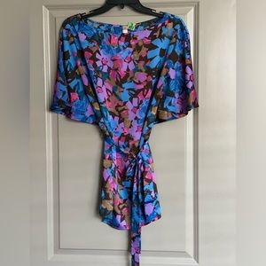 Can be worn as a dress or top. The belt is also removable but has loops.